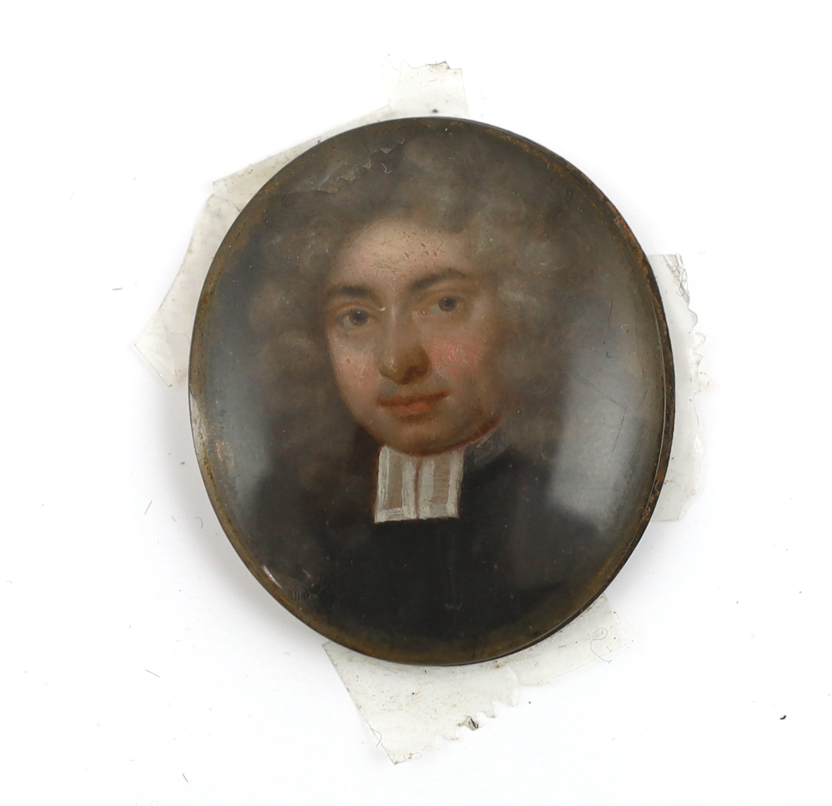 English School circa 1730, Portrait miniature of a clergyman, oil on copper, 3.8 x 3.3cm.